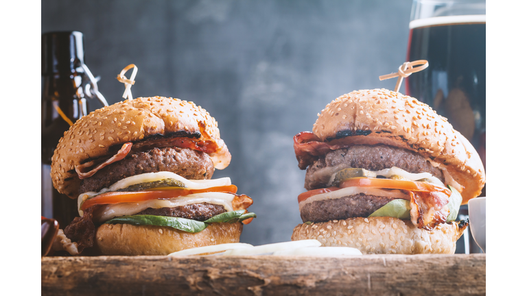Hamburger and dark beer in vintage style