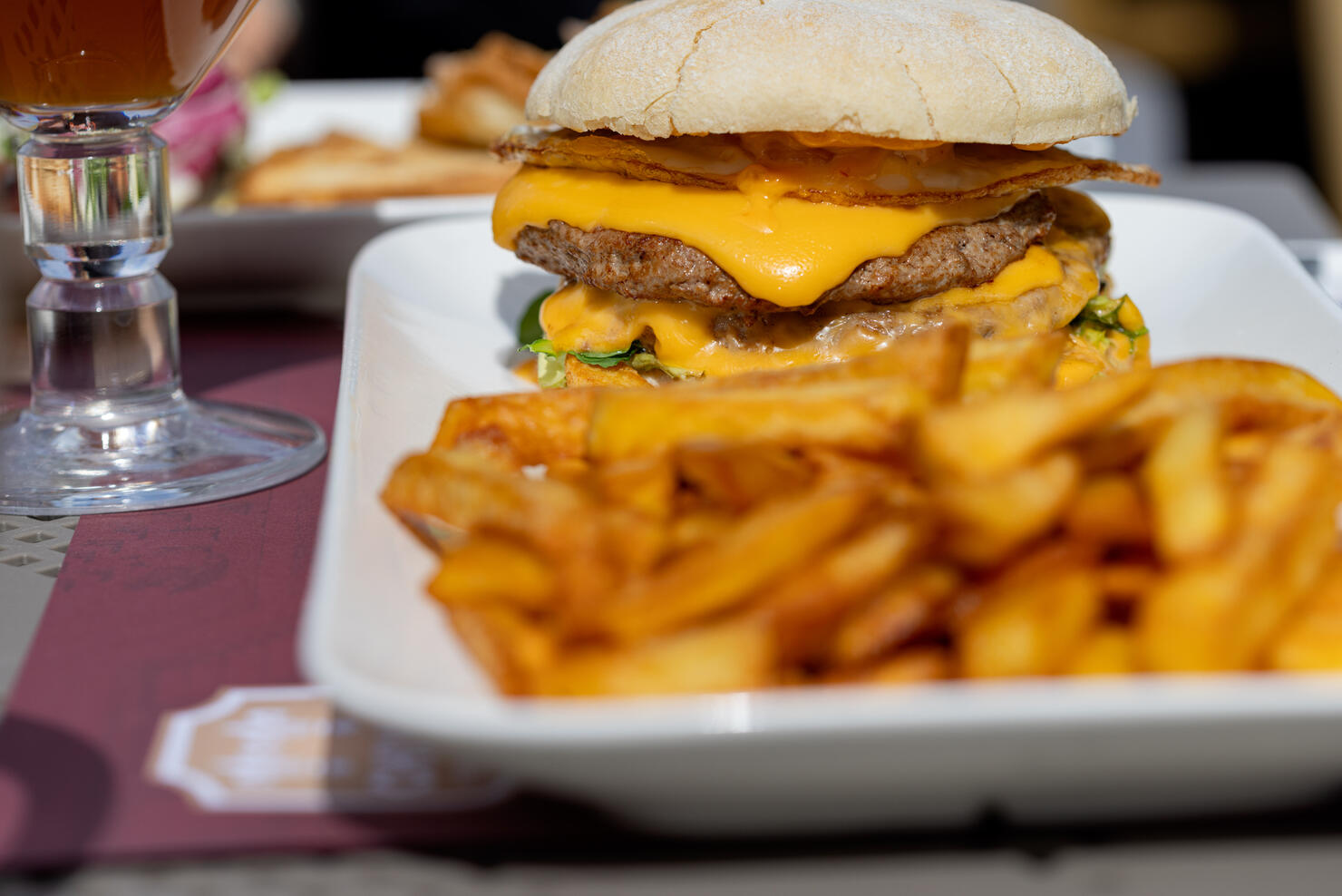 Double cheeseburger and fries on a casual day.