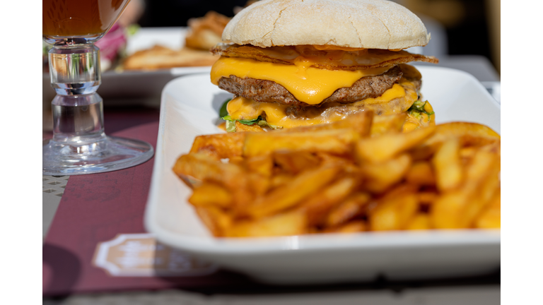 Double cheeseburger and fries on a casual day.