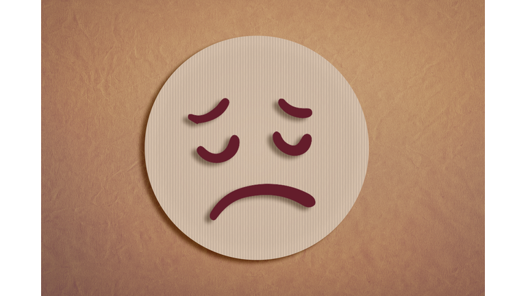 sad felt emoji in paper cutting work