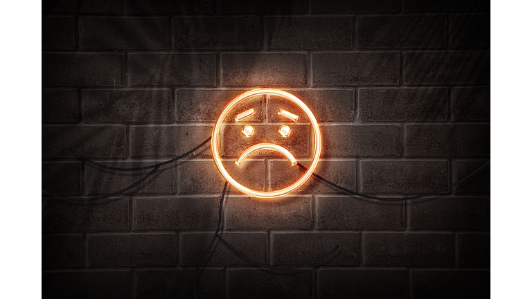 sad emoji in neon style