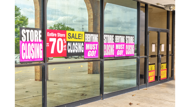 Going Out of Business Signs in Retail Store Windows