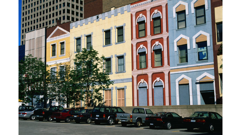 Downtown street scene: cars parked outside painted houses - Minneapolis-St Paul, Minnesota