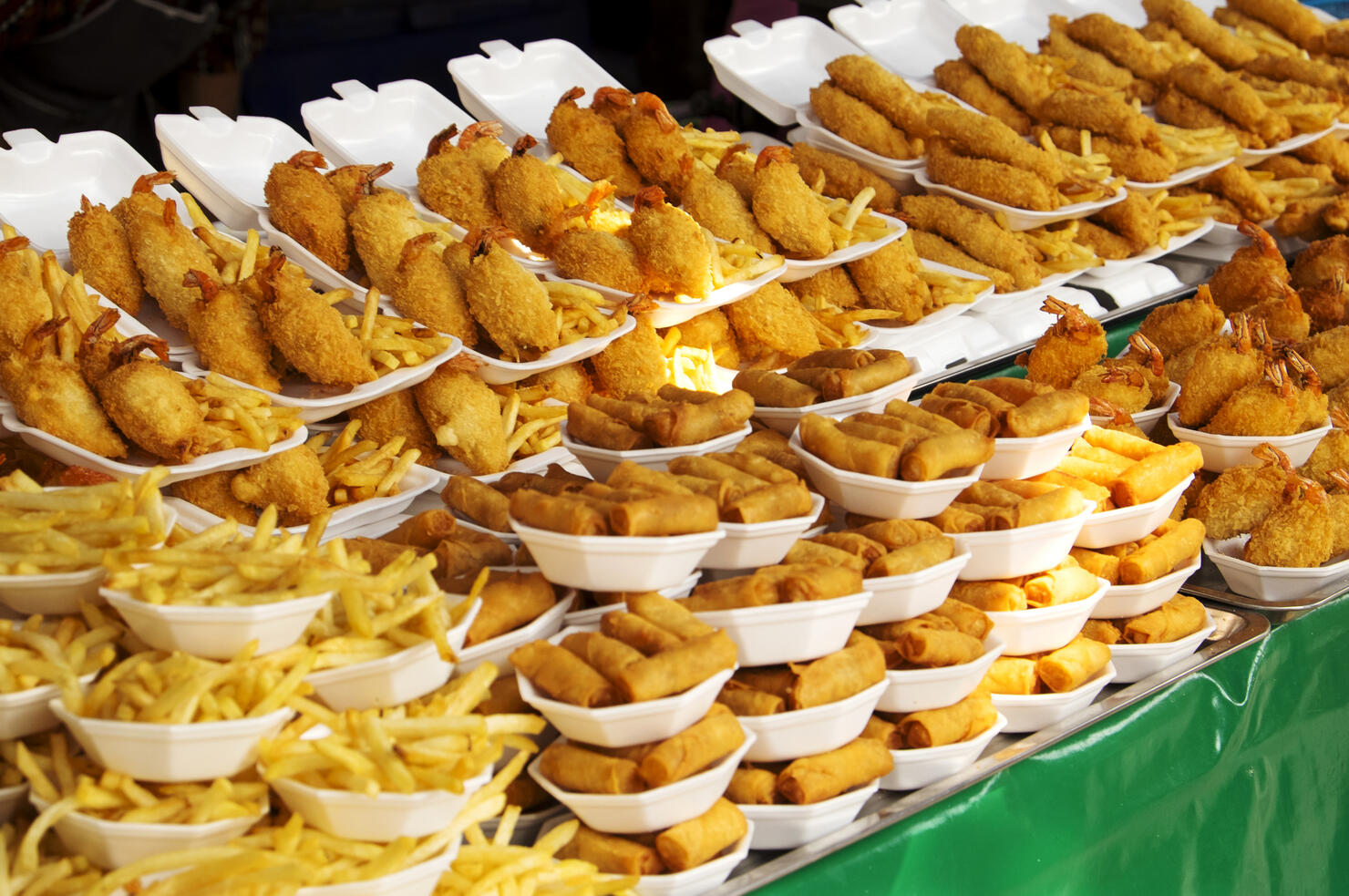 Plates of fried food for sale in market