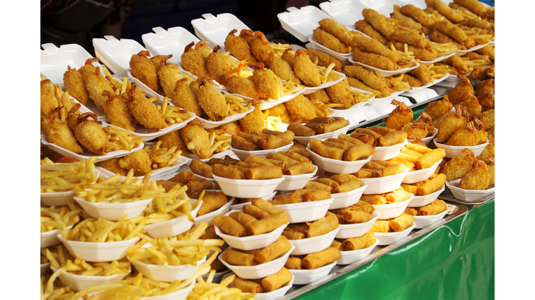 Plates of fried food for sale in market
