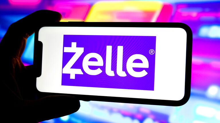In this photo illustration, a Zelle logo is displayed on the