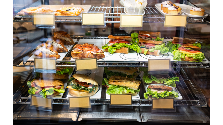 Display case of sandwiches,hamburger and pastries in cafe