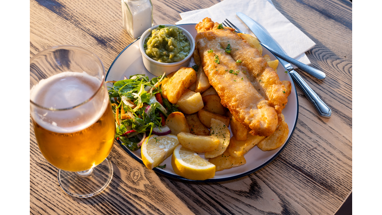 Close up Shot of Fish and Chip Food with Side Garnishes