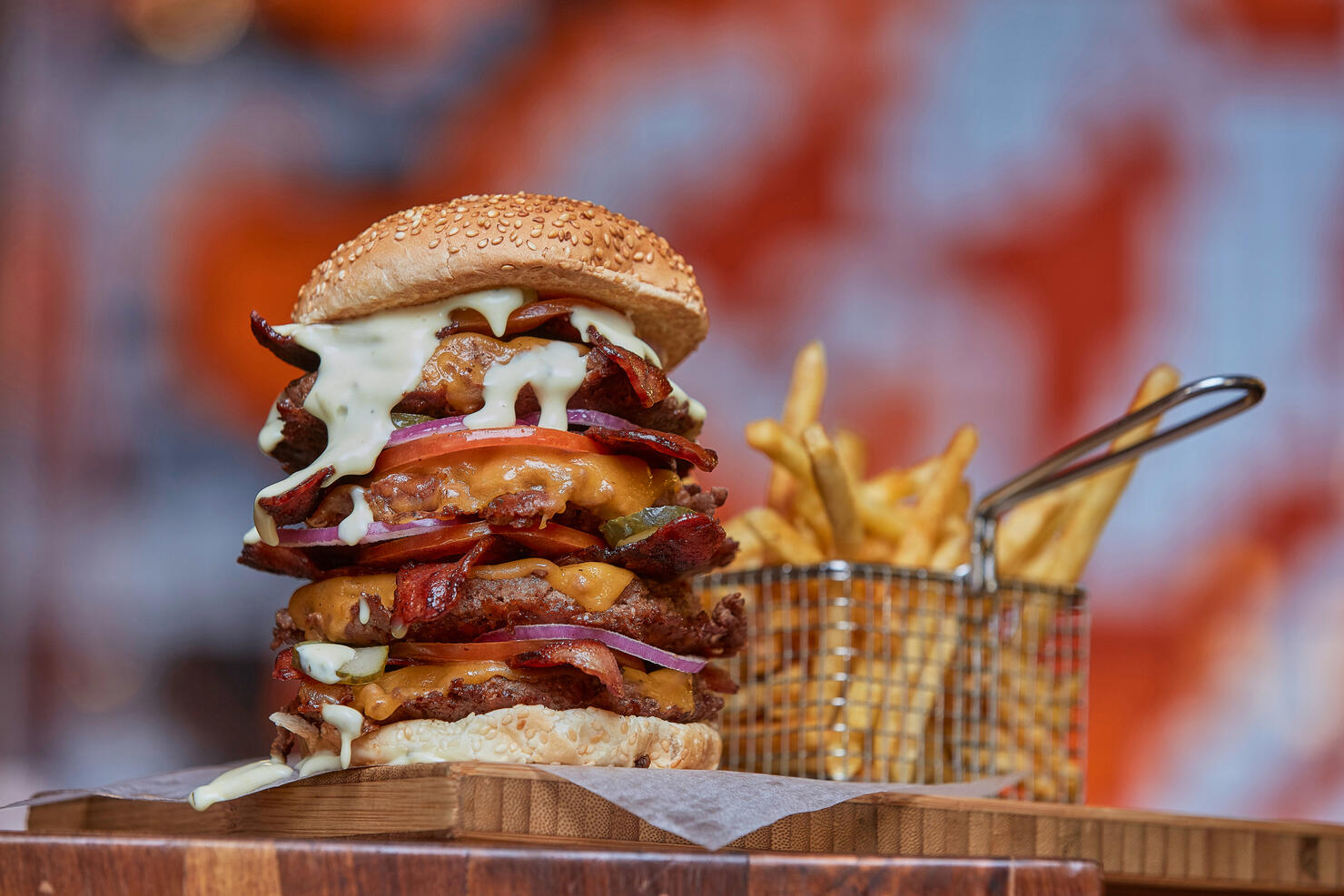 Close-up of giant burger and fries