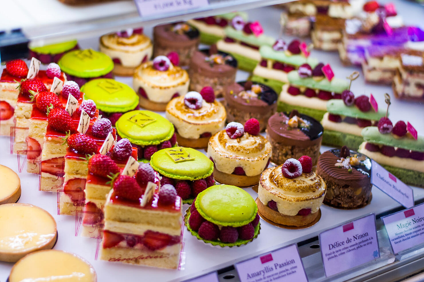 Pastry shop with variety of donuts, muffins, creme brulee, cakes
