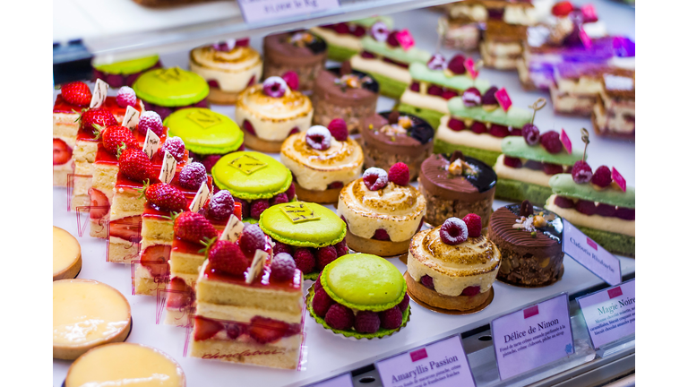 Pastry shop with variety of donuts, muffins, creme brulee, cakes
