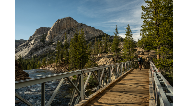 Woman Stops at end of Bridge toward Glen Aulin
