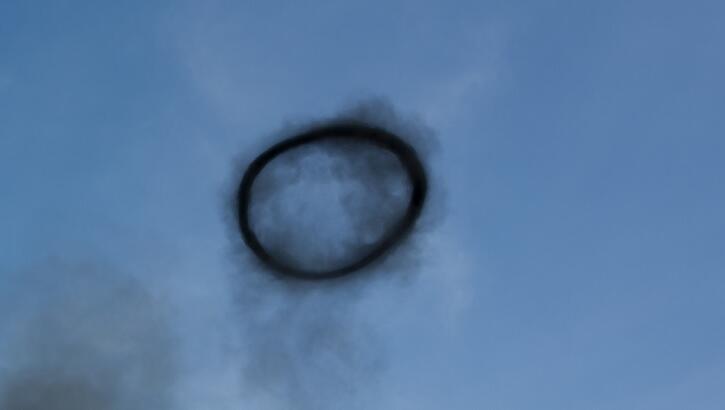 Watch: Sizeable Black Smoke Ring in Sky Confounds Kansas Motorcyclist