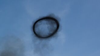 Watch: Sizeable Black Smoke Ring in Sky Confounds Kansas Motorcyclist