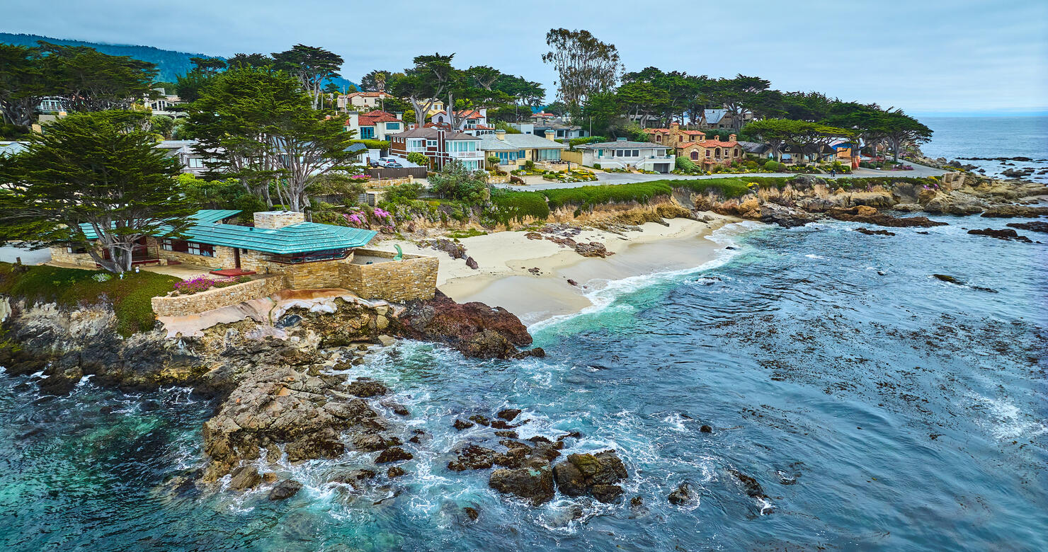 Aerial Clinton Walker House by Frank Lloyd Wright and Carmel Beach with houses