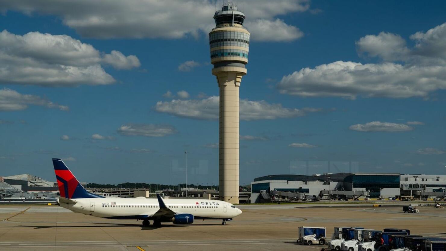 Travelers At HartsfieldJackson Atlanta International Airport As Congress Averts FAA Lapse With Stopgap Passage