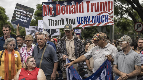 First Group Of White South Africans Heads To U.S. Under Trump Refugee Plan
