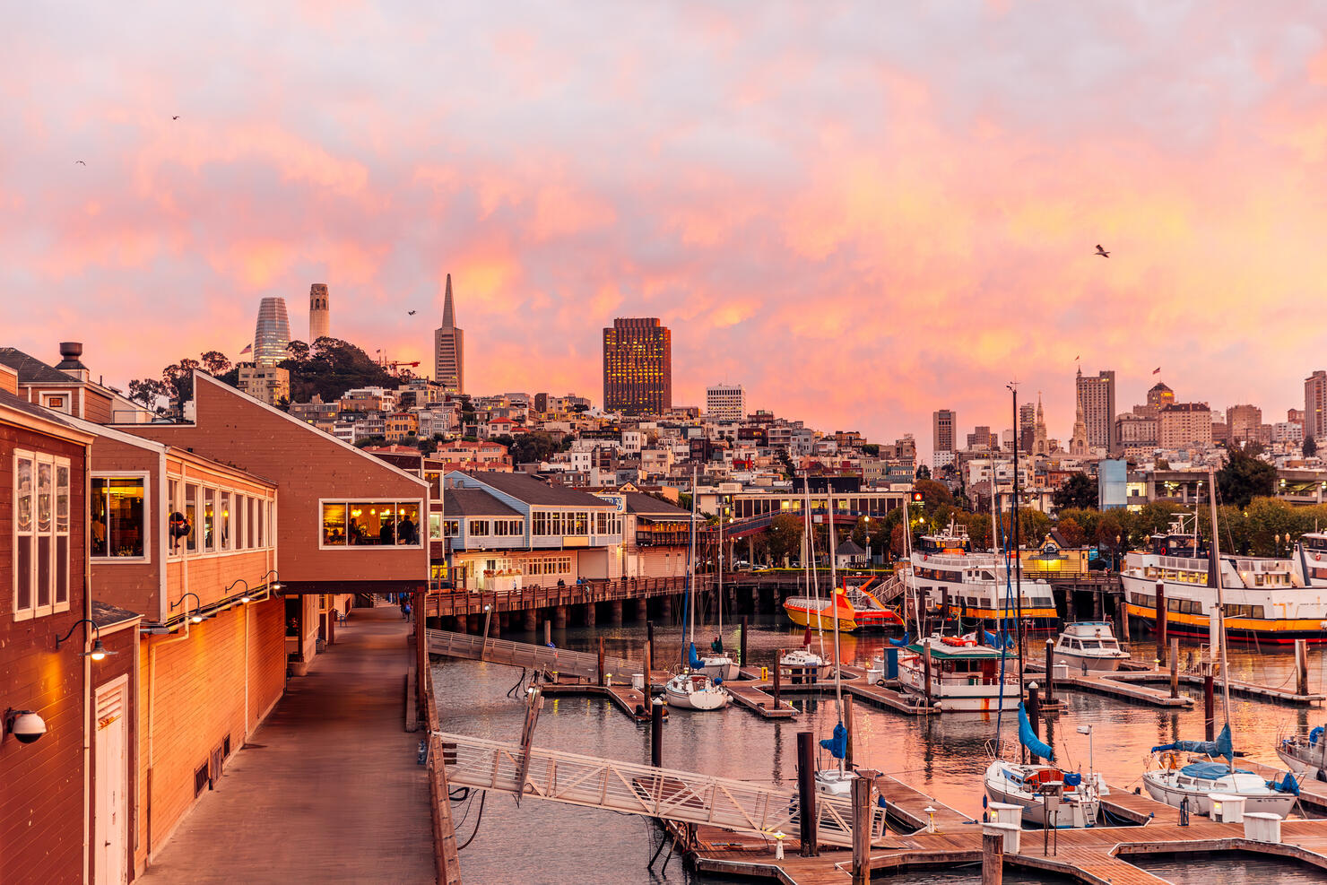 Pier 39 and San Francisco skyline during dramatic sunset, California, USA