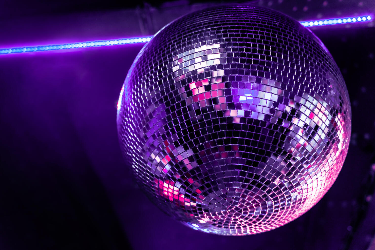 Nightclub disco ball in very peri, color of the year 2022