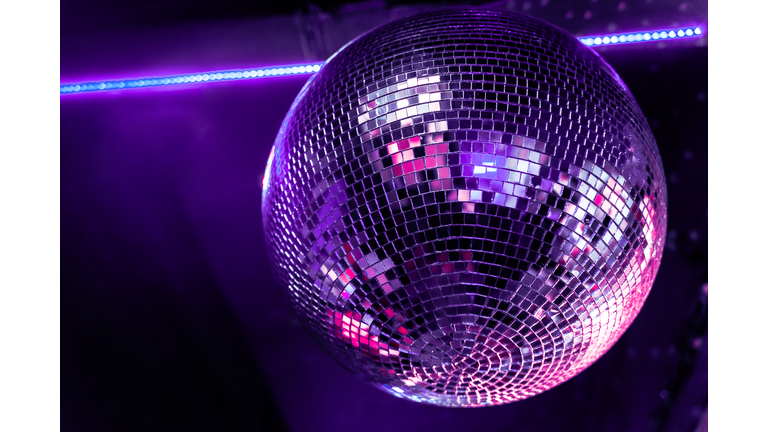 Nightclub disco ball in very peri, color of the year 2022