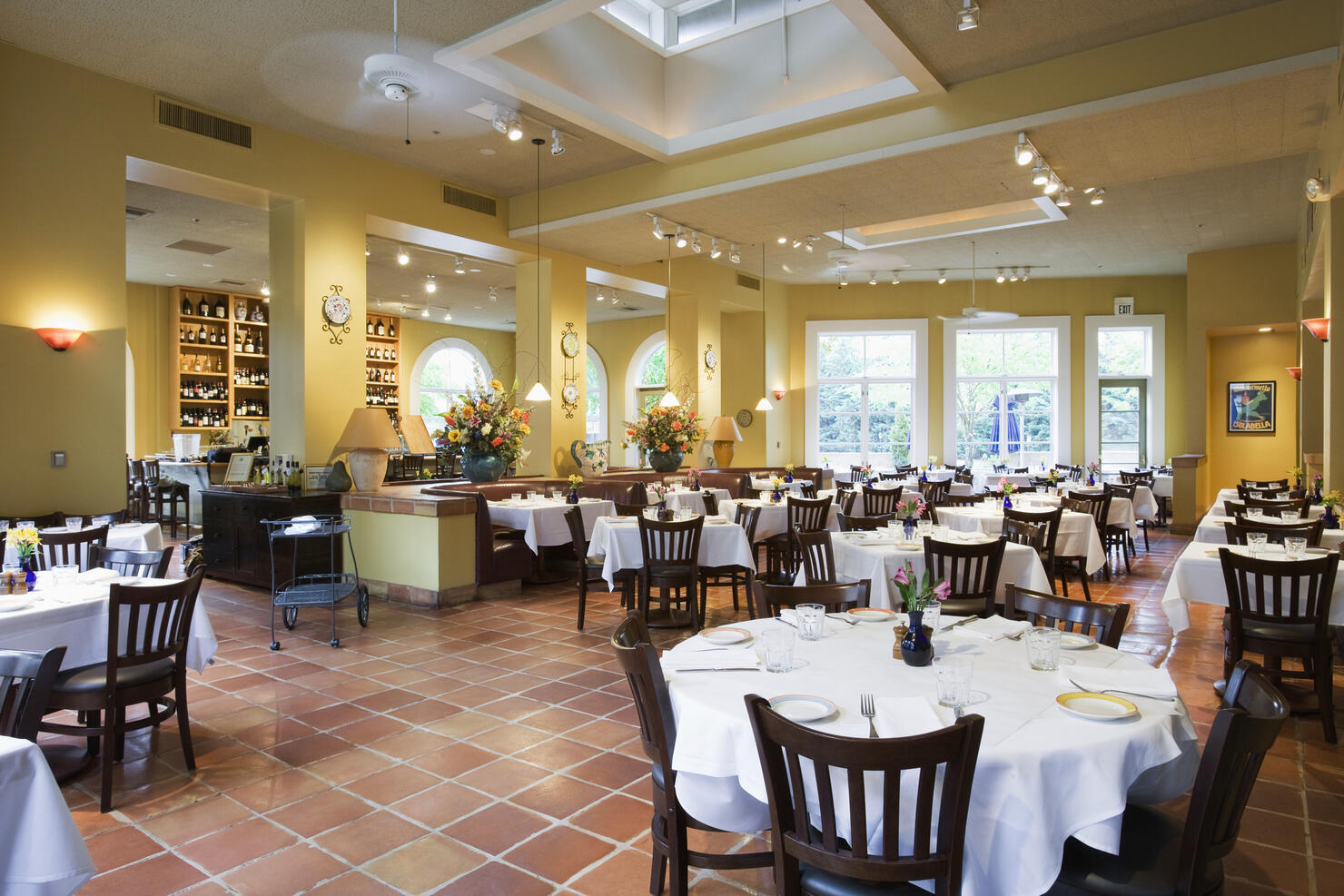 Tables and chairs in empty restaurant