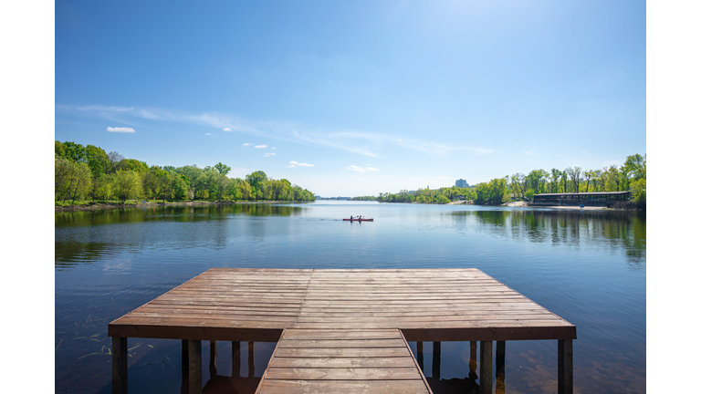 Wooden pier on the river in sunny day