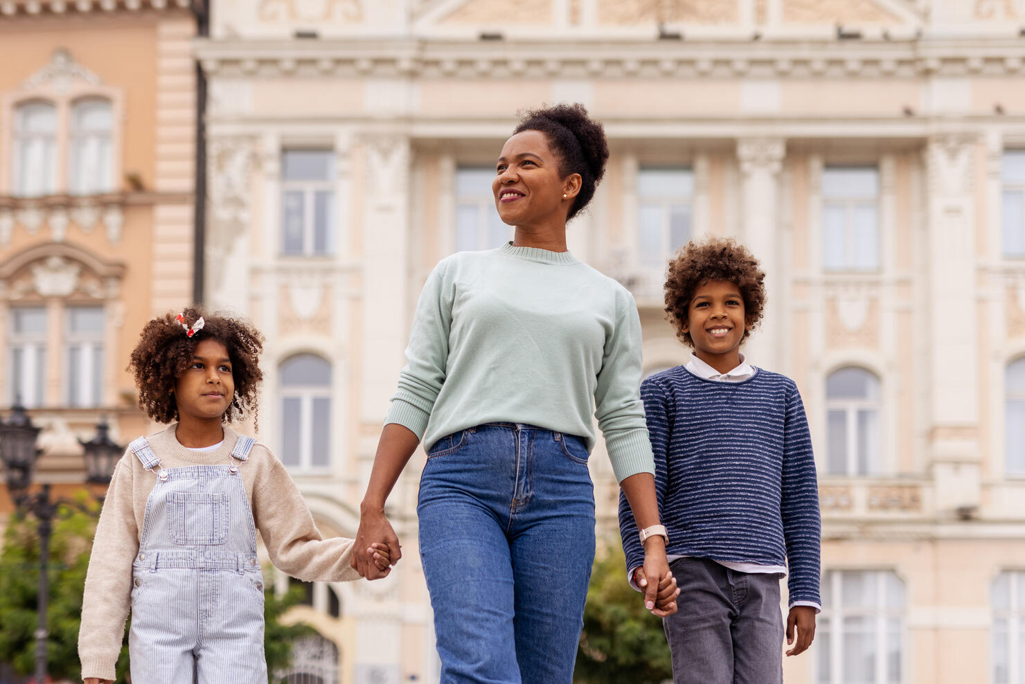 Single African American Mother With Her Children in City Center – Family Bond Concept