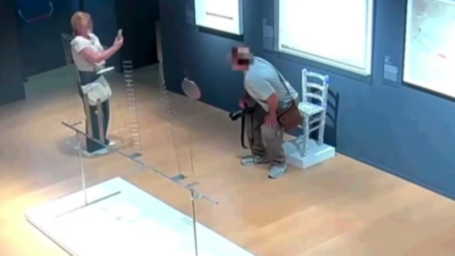 Tourist breaks chair at Palazzo Maffei Verona.