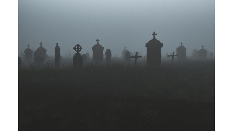 Spooky graveyard at night