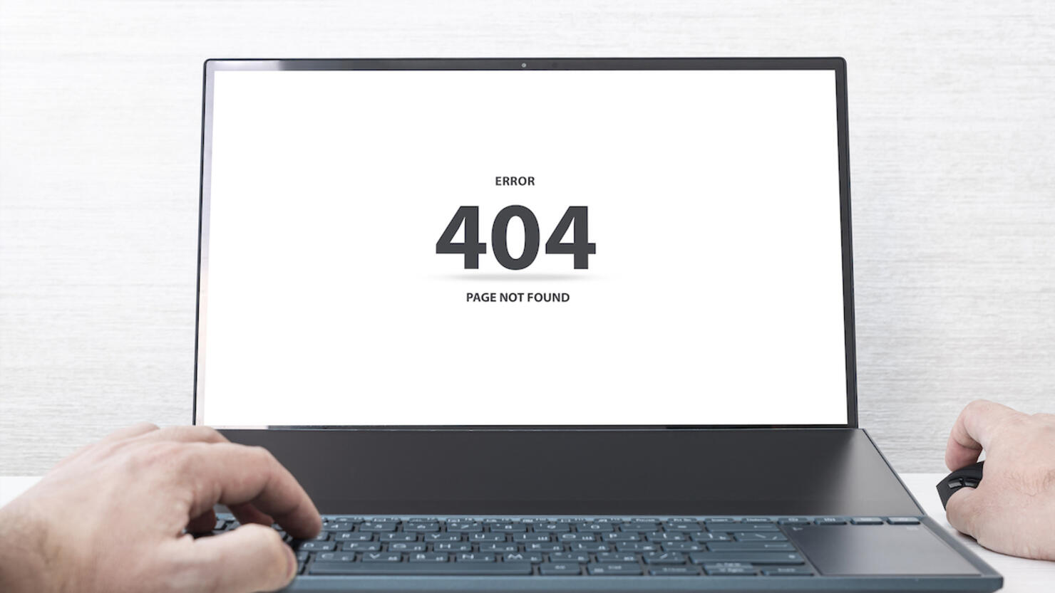the message on the screen page not found problem with loading the site. Man working on laptop, 404 error,