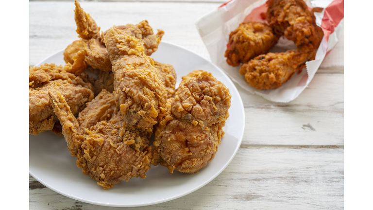 Fried chicken on a wooden floor.