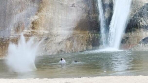 Heart-Stopping Video Shows Two Tourists Narrowly Avoid Giant Falling Rocks