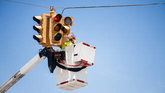 WATCH: 18-Wheeler Smashes Into Utility Worker Left Dangling Over Street