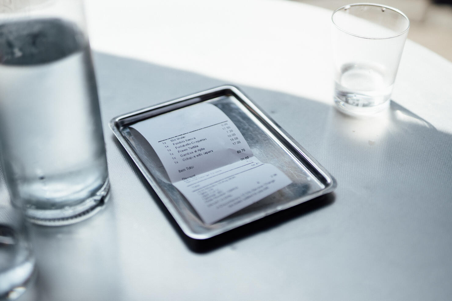 Guest check on tray