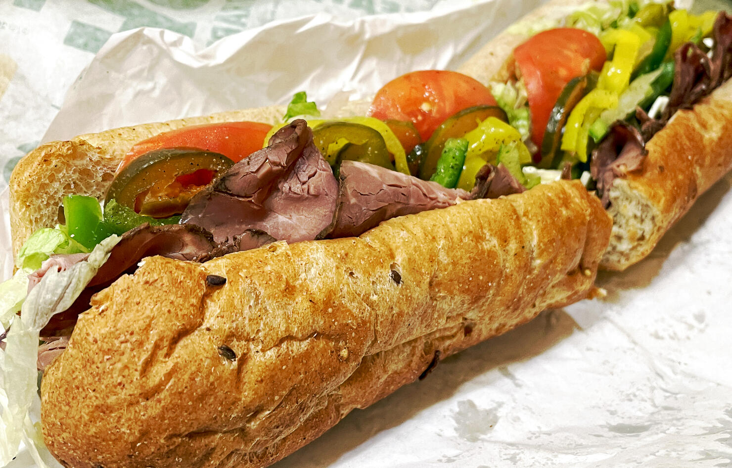 Fast food with a Roast Beef Submarine Sandwich with lots of veggies