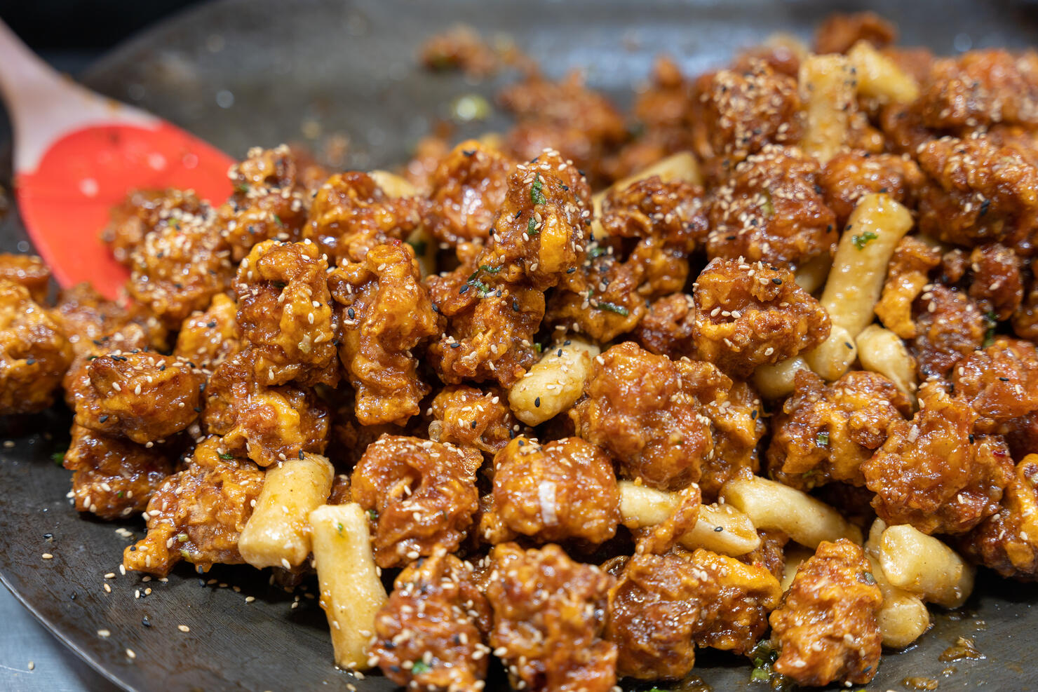 Korean spicy fried chicken wiath Gochujang sauce on market street