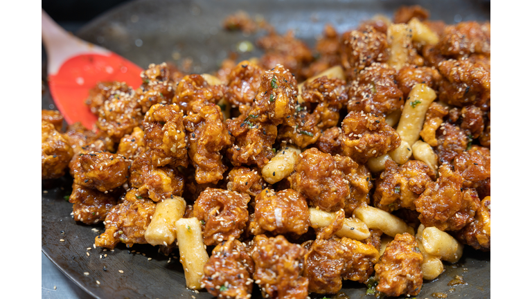 Korean spicy fried chicken wiath Gochujang sauce on market street