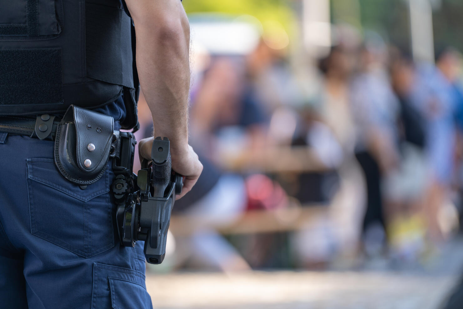 police officer with weapon at public events Close-up police equipment, weapon