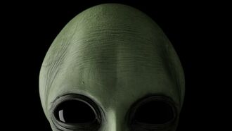 Watch: Eerie Alien-Like Head Filmed Peeking Out from Behind Car in Mexico