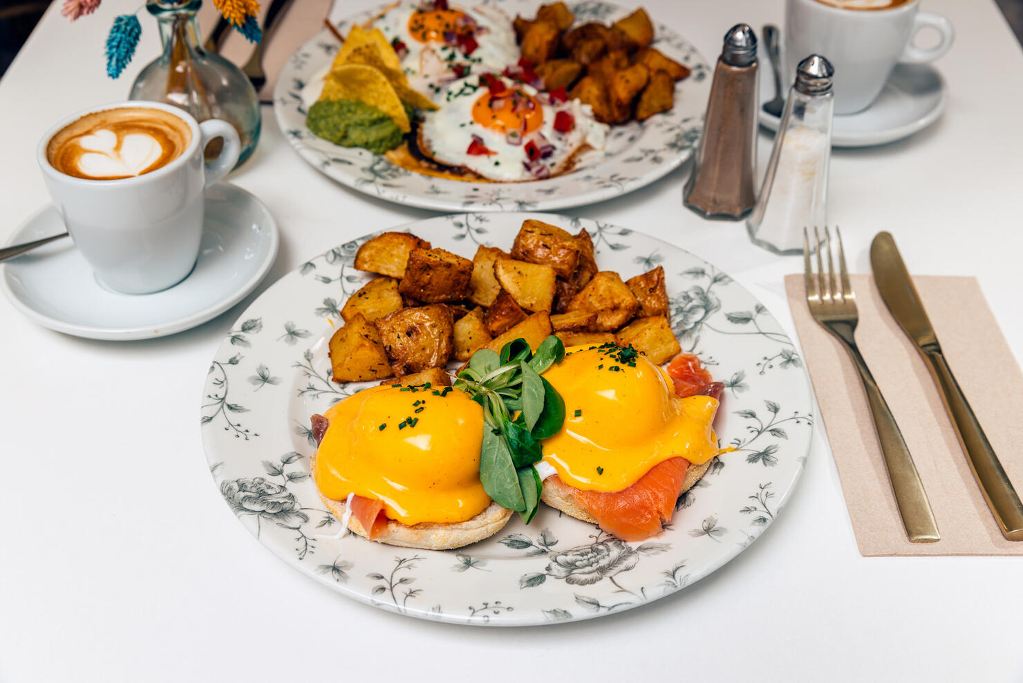 Eggs Benedict with salmon served with roasted potatoes for brunch