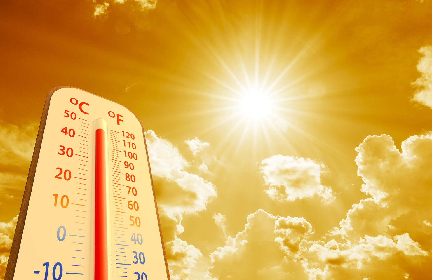 hot temperature,Thermometer on yellow sky with sun shining