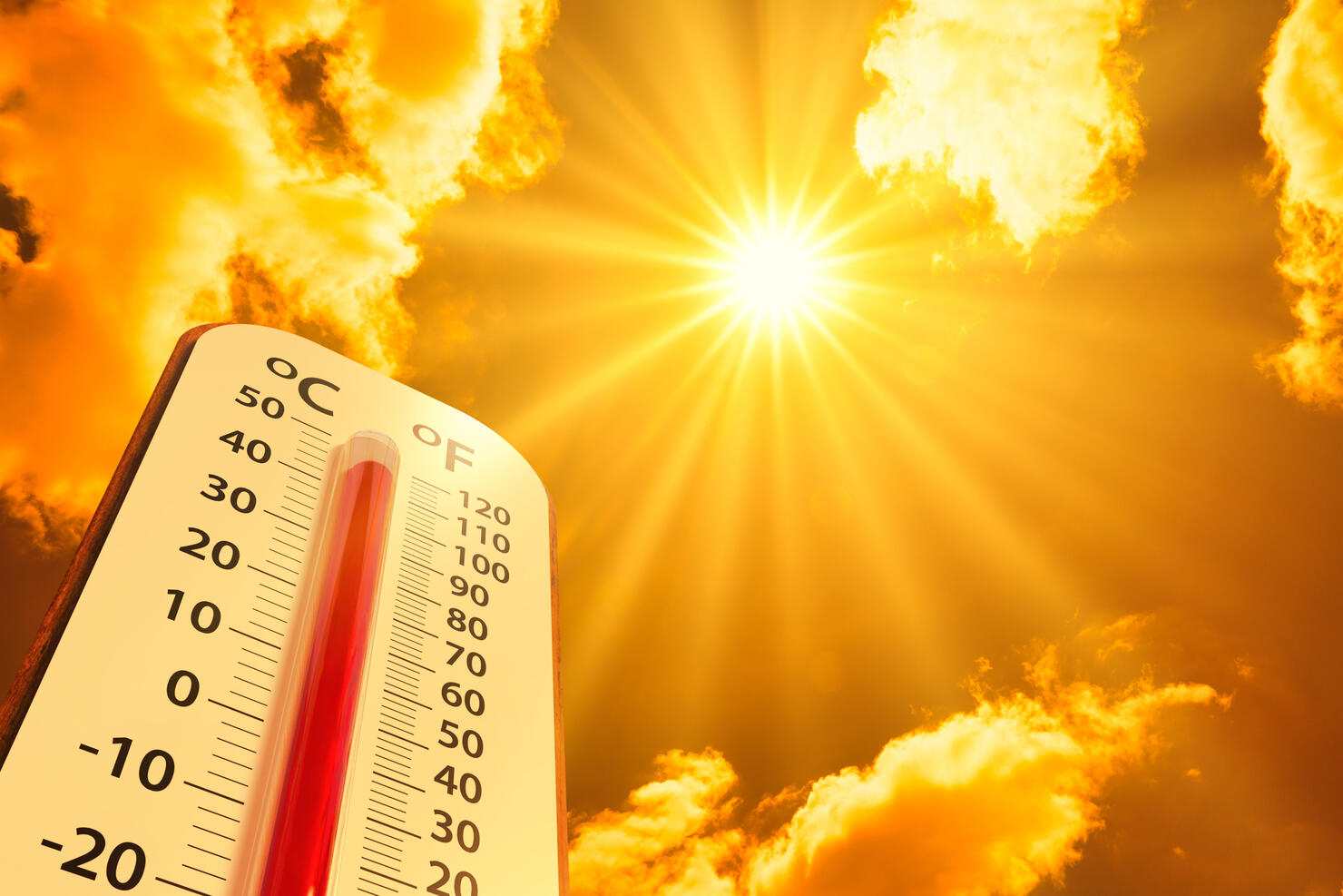 hot temperature,Thermometer on yellow sky with sun shining