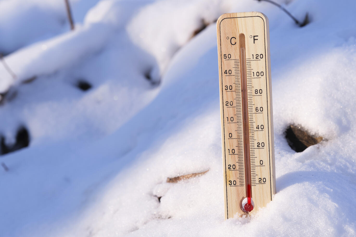 Outdoor thermometer street in snow with low sub zero temperature in sunny frosty weather.