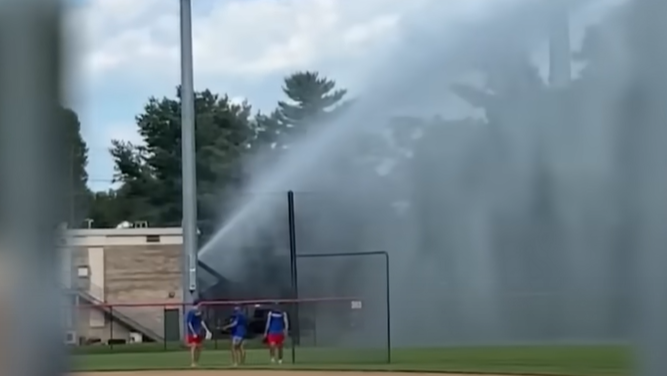Firefighter Ends Baseball Game with Fire Hose After Ball Hits His Car