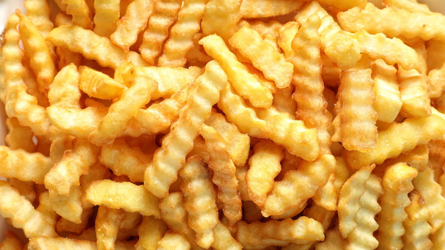 Close up large group of french fries background