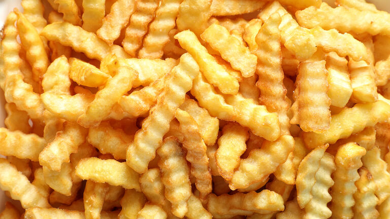 Close up large group of french fries background