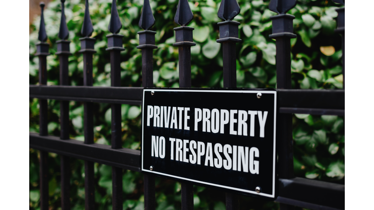No Trespassing Sign on Fence