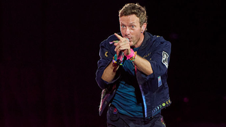Watch Chris Martin Playfully Serenade Fan In Viral Coldplay Concert Clip