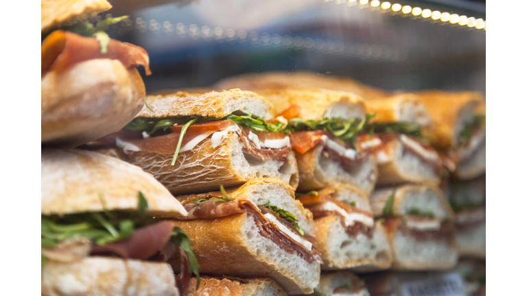 Panini made of arugula, tomato and prosciutto crudo