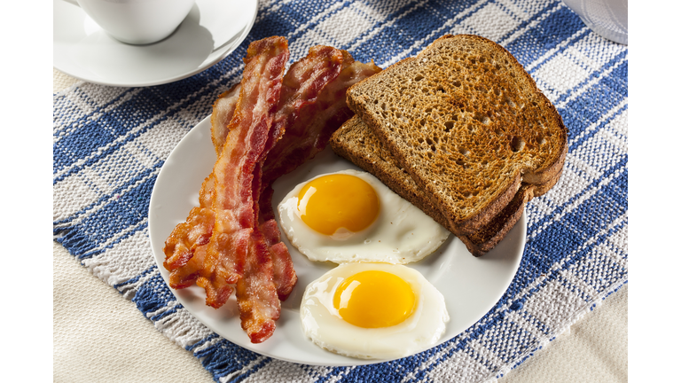 Organic Sunnyside up Egg with toast and bacon